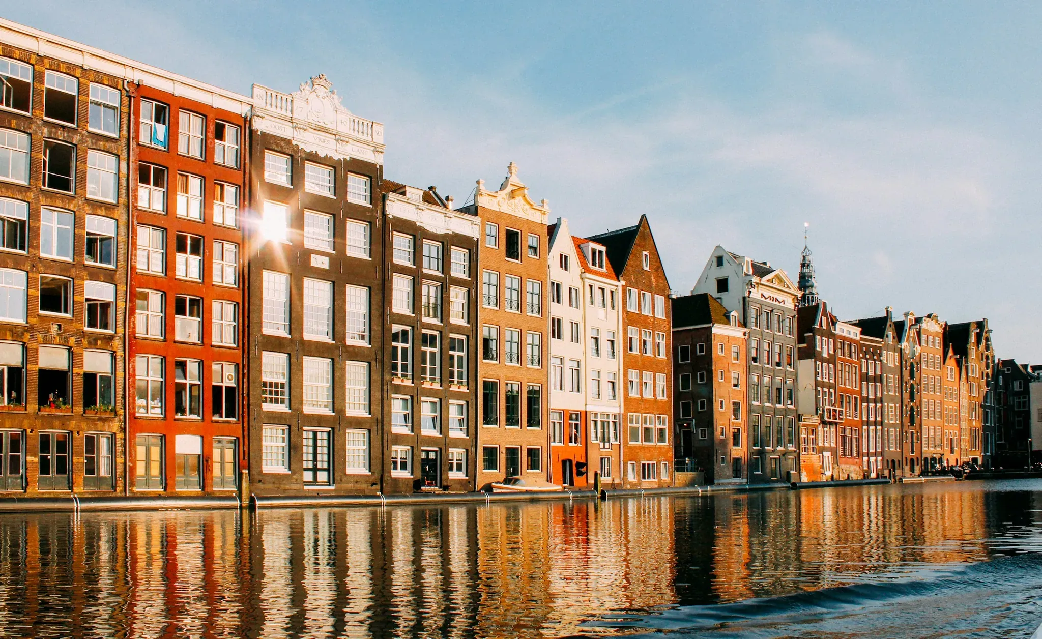 Damrak canal houses in late sun, Amsterdam